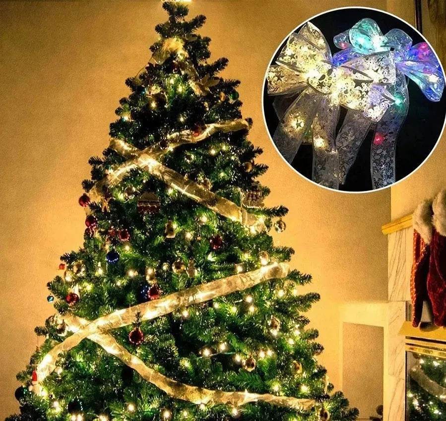 Noeud papillon en ruban de Noël avec guirlande lumineuse