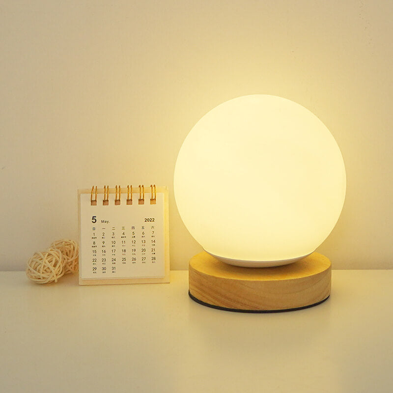 Lampe de table de chevet LED ronde rechargeable par USB NovaGlow dans un style minimaliste moderne