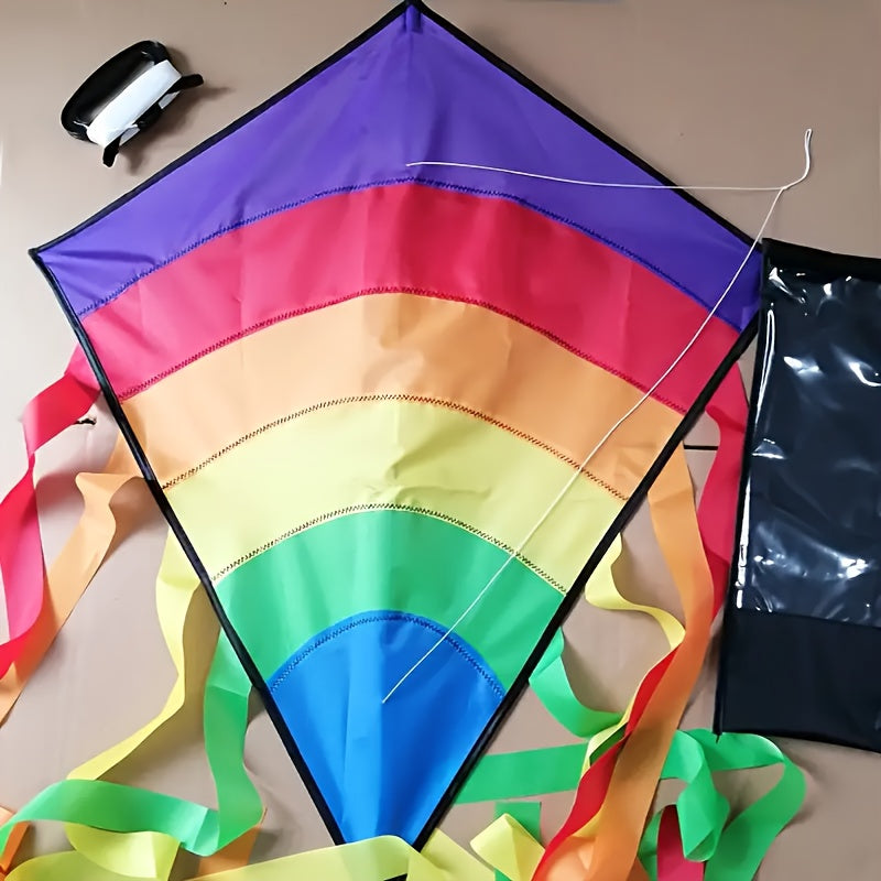 Cerf-volant arc-en-ciel avec de longs rubans colorés pour la plage et les jeux en plein air