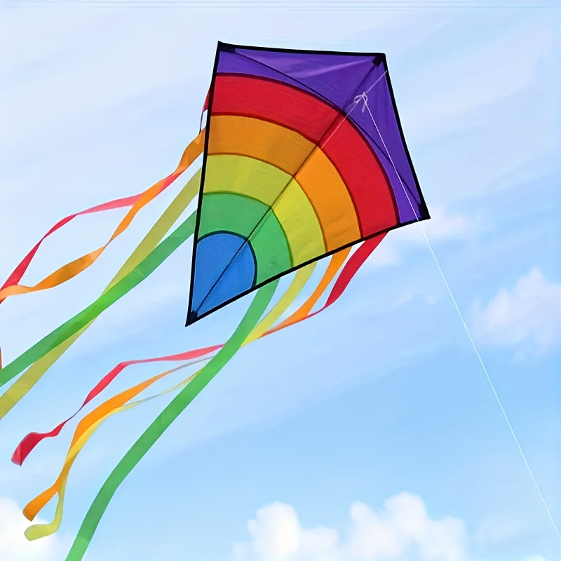 Cerf-volant arc-en-ciel avec de longs rubans colorés pour la plage et les jeux en plein air