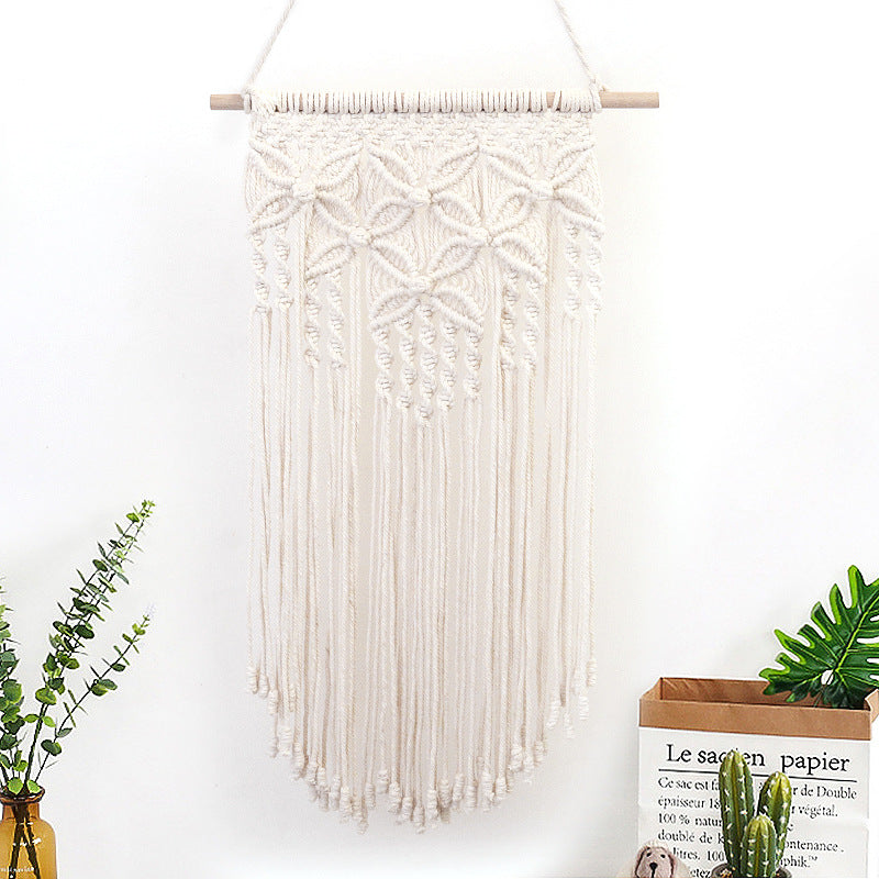 Décoration murale en macramé avec décorations élaborées
