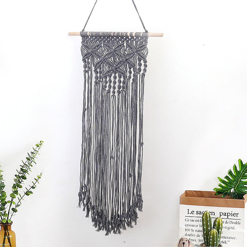 Décoration murale en macramé avec décorations élaborées