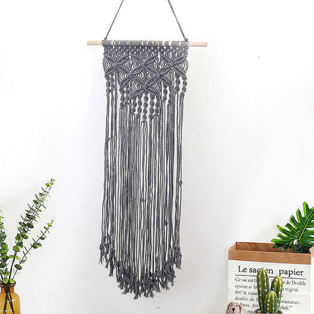 Décoration murale en macramé avec décorations élaborées