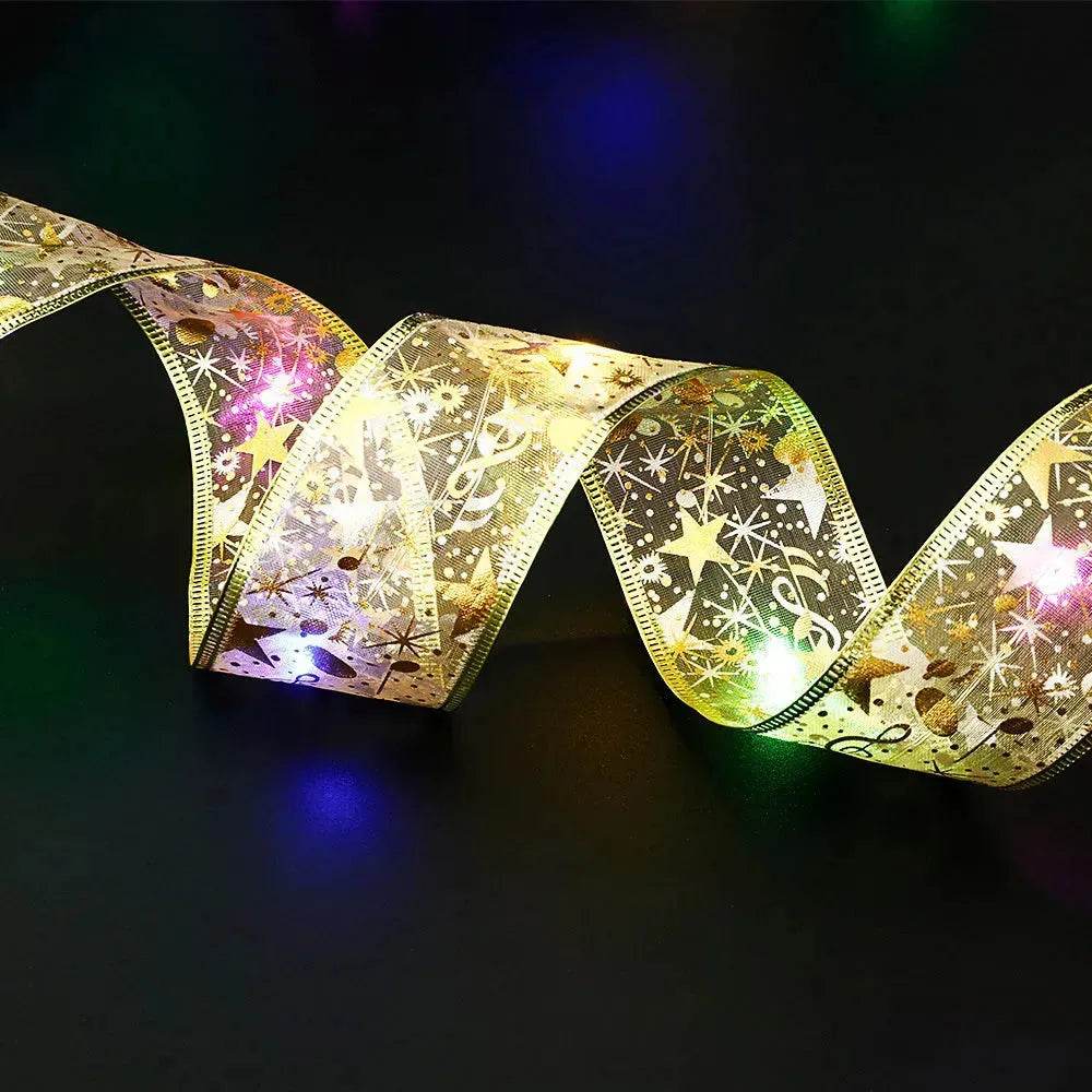 Noeud papillon en ruban de Noël avec guirlande lumineuse