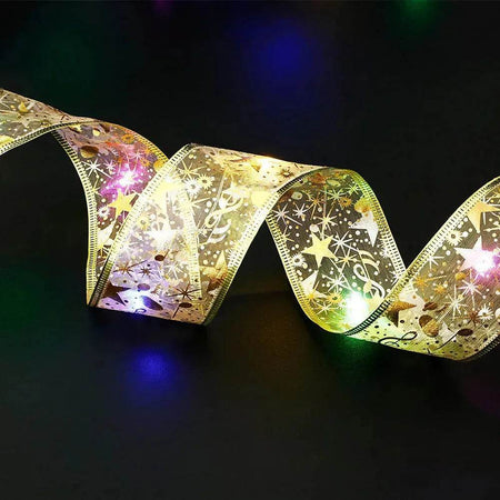 Noeud papillon en ruban de Noël avec guirlande lumineuse