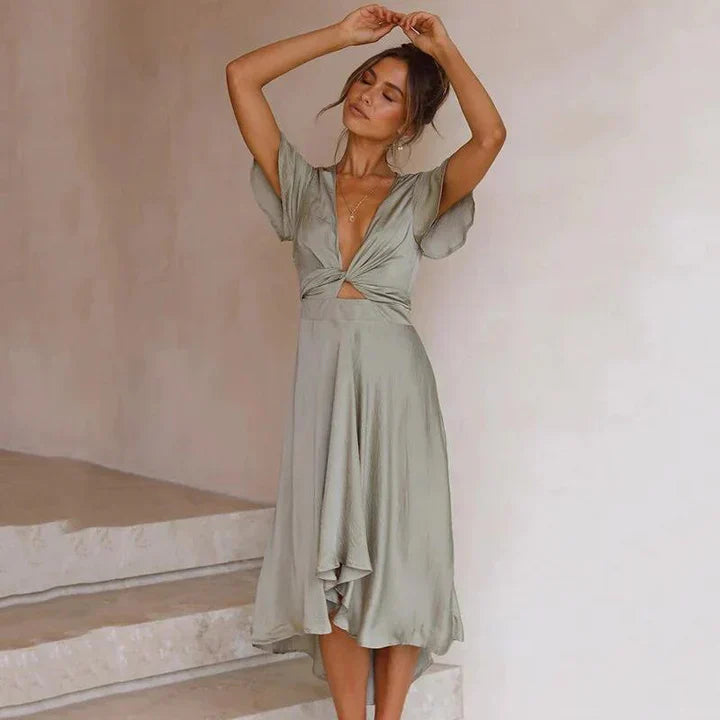 Robe midi élégante avec détail de nœud et jupe fluide pour les journées d'été