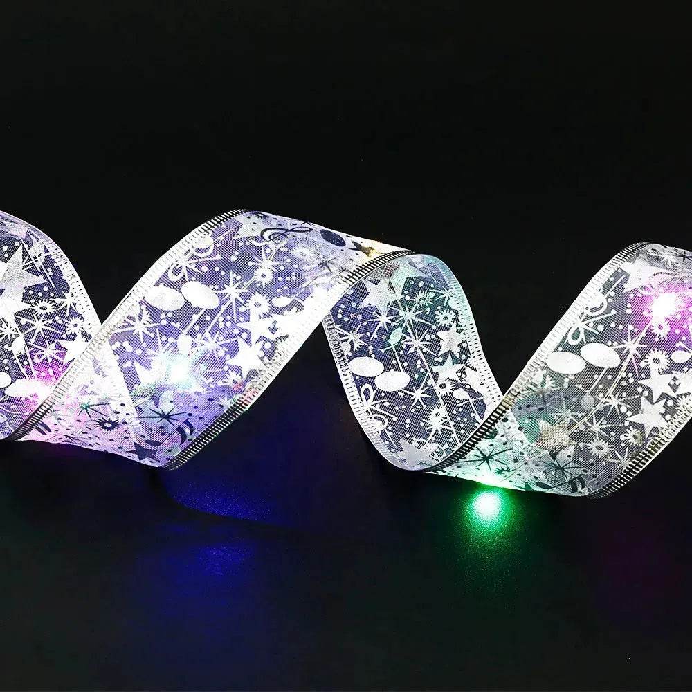 Noeud papillon en ruban de Noël avec guirlande lumineuse