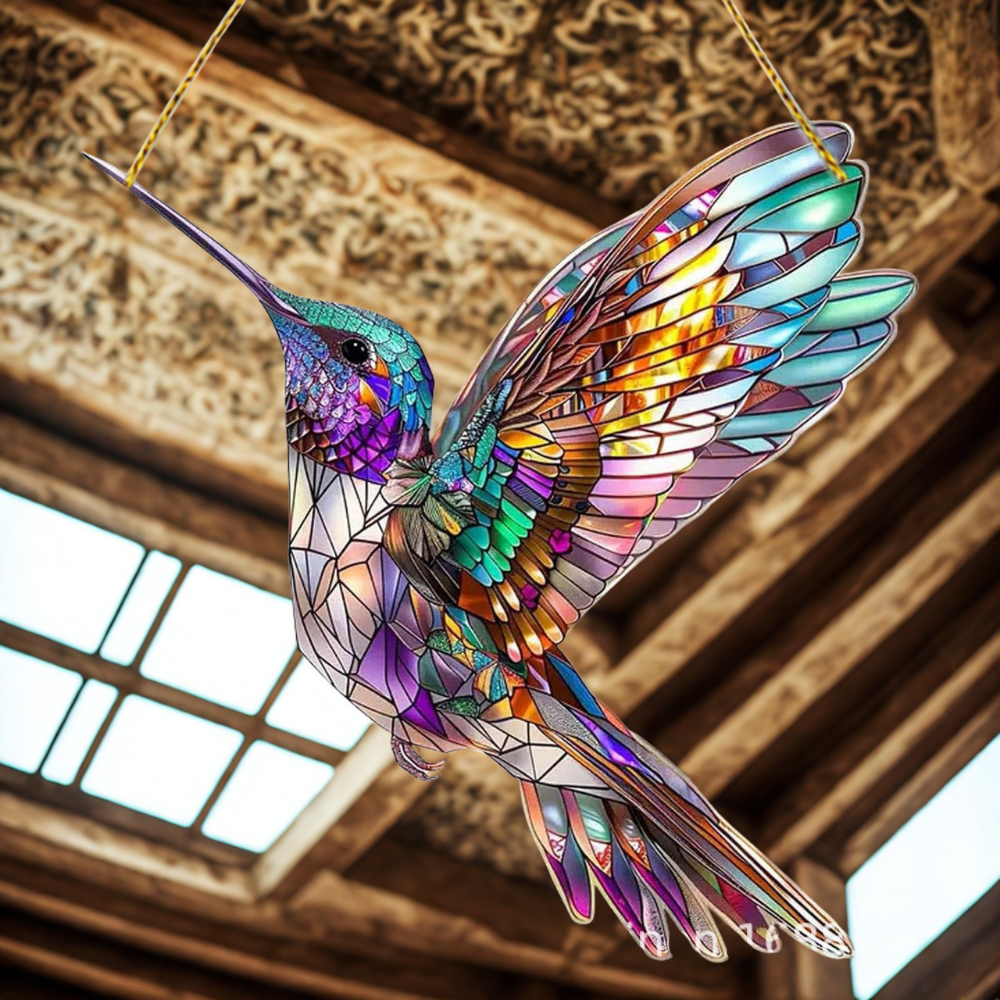 Détail du motif oiseau bleu sur l'attrape-soleil