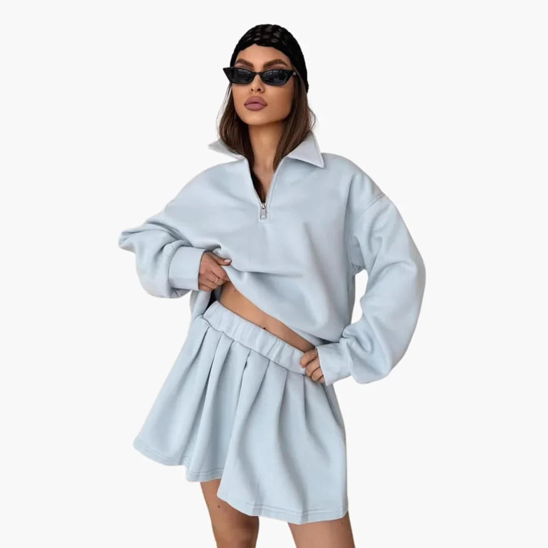 Pull femme avec demi-zip et jupe plissée