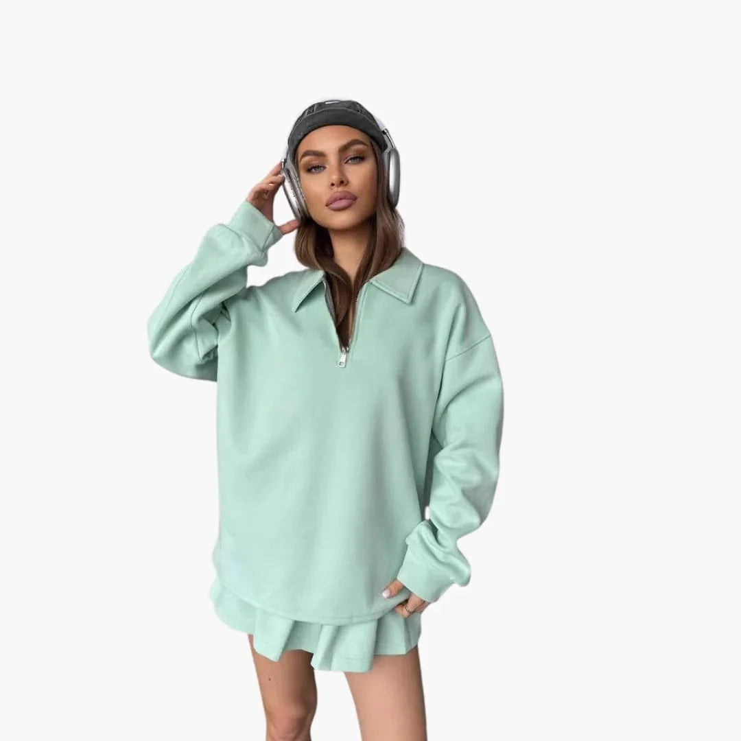 Pull femme avec demi-zip et jupe plissée