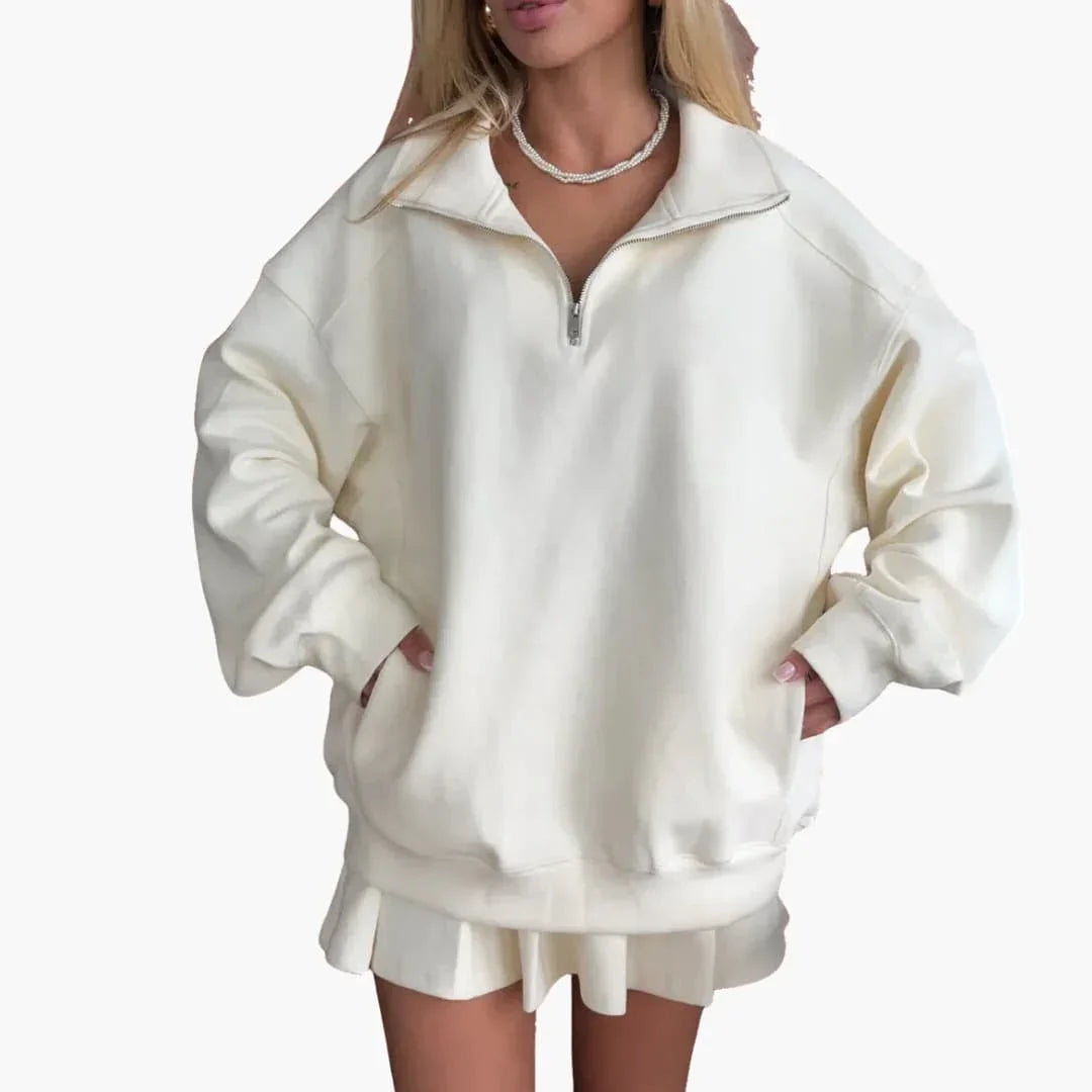 Pull femme avec demi-zip et jupe plissée
