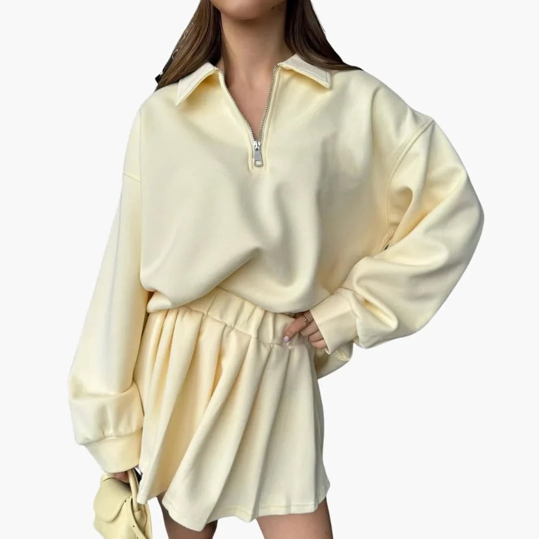 Pull femme avec demi-zip et jupe plissée
