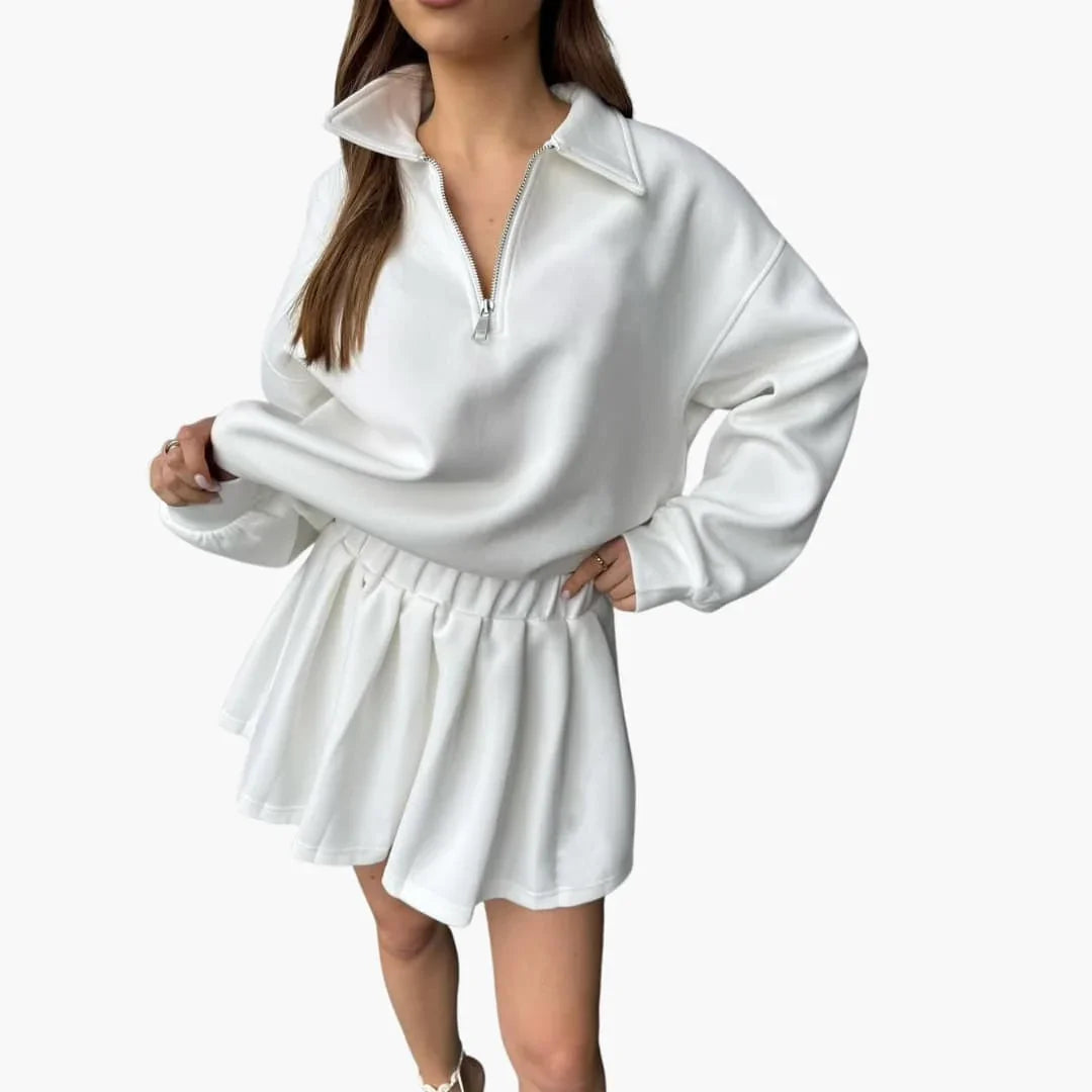 Pull femme avec demi-zip et jupe plissée
