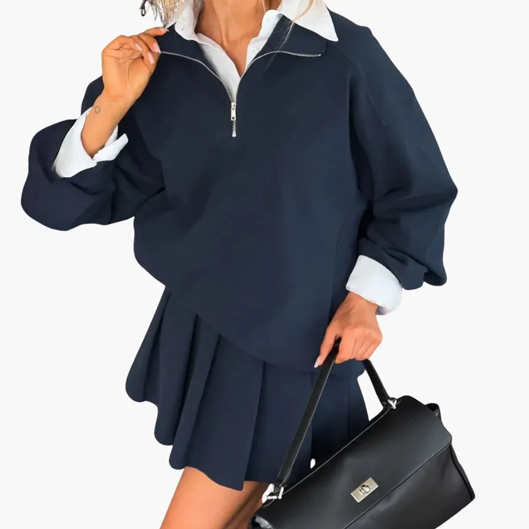Pull femme avec demi-zip et jupe plissée