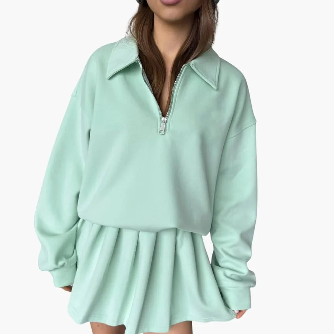 Pull femme avec demi-zip et jupe plissée