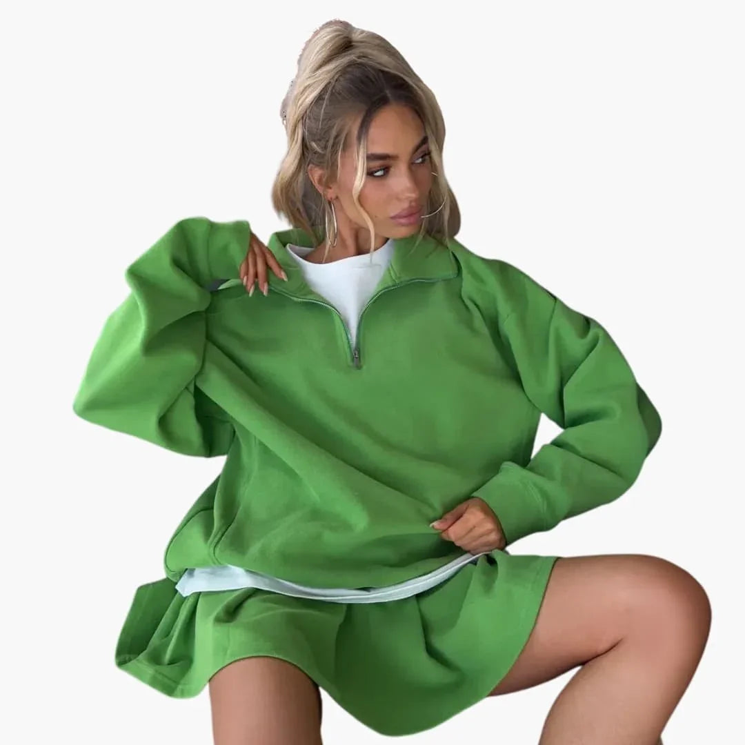 Pull femme avec demi-zip et jupe plissée