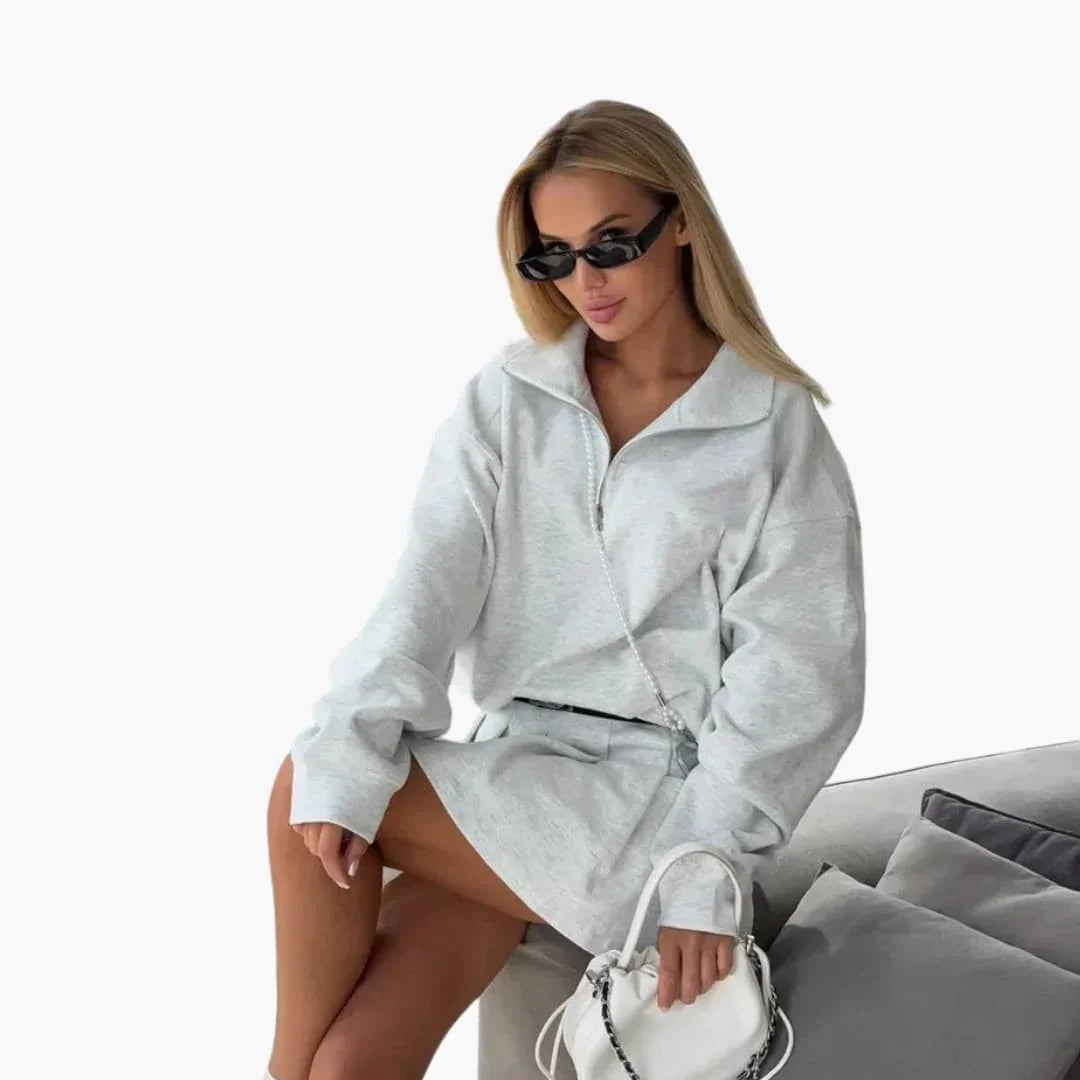 Pull femme avec demi-zip et jupe plissée