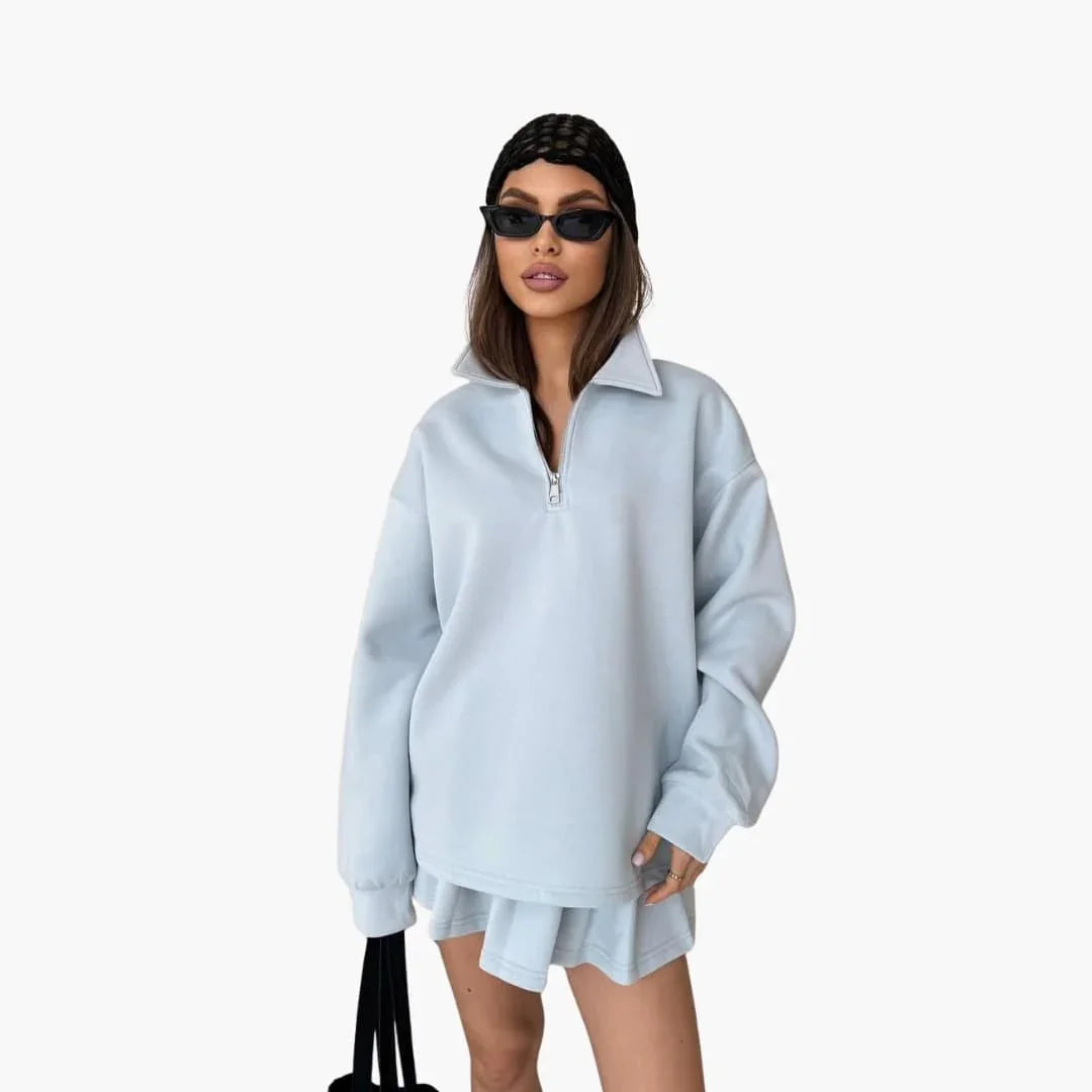Pull femme avec demi-zip et jupe plissée