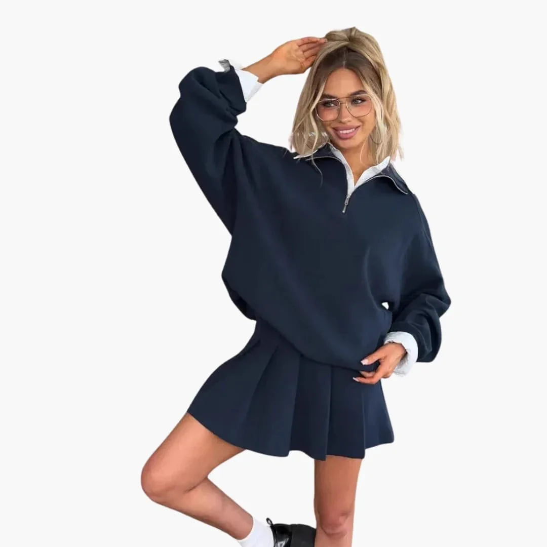 Pull femme avec demi-zip et jupe plissée