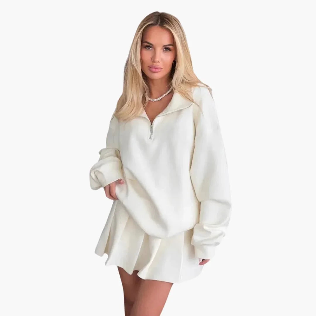Pull femme avec demi-zip et jupe plissée