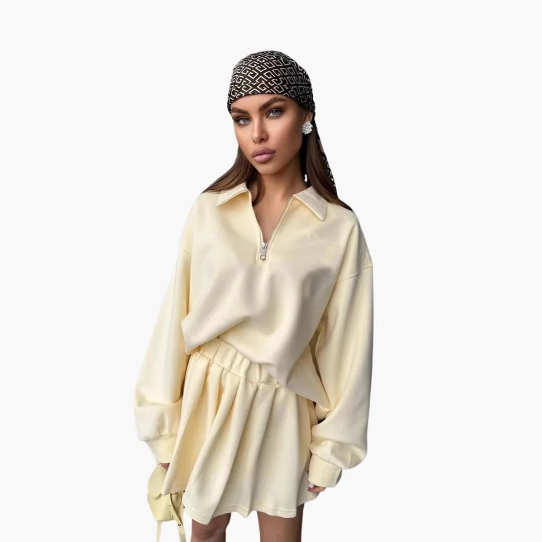Pull femme avec demi-zip et jupe plissée