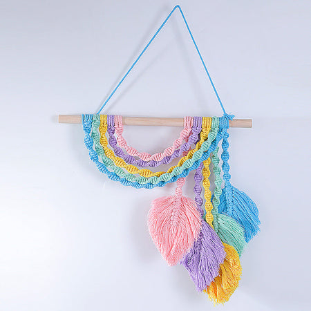 Décoration murale en macramé avec bol élévateur à franges colorées
