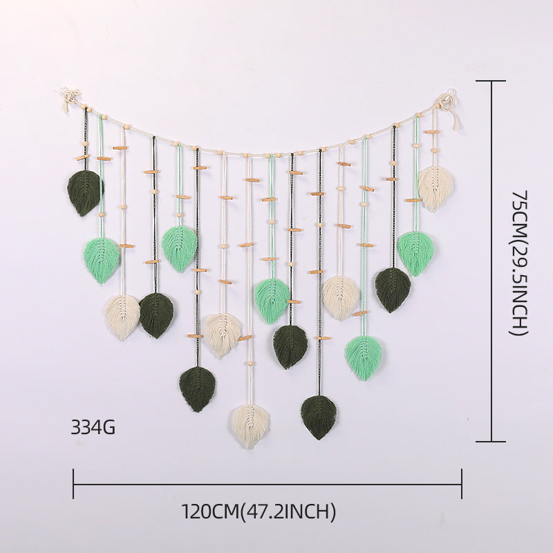 Décoration murale en macramé avec motif de feuilles