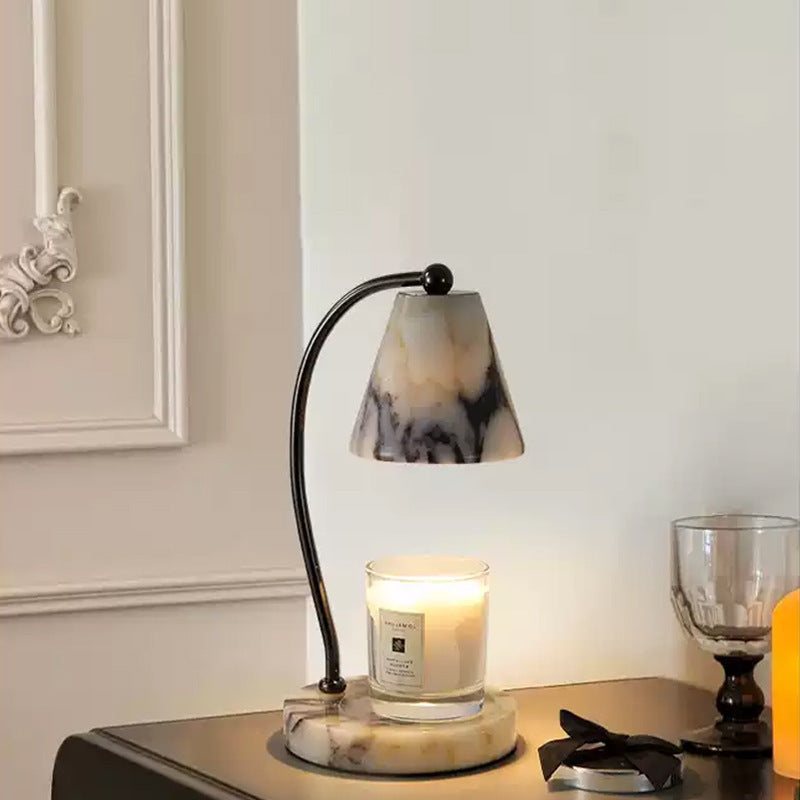 Lampe de chevet en marbre avec porte-bougie intégré et bras en métal courbé