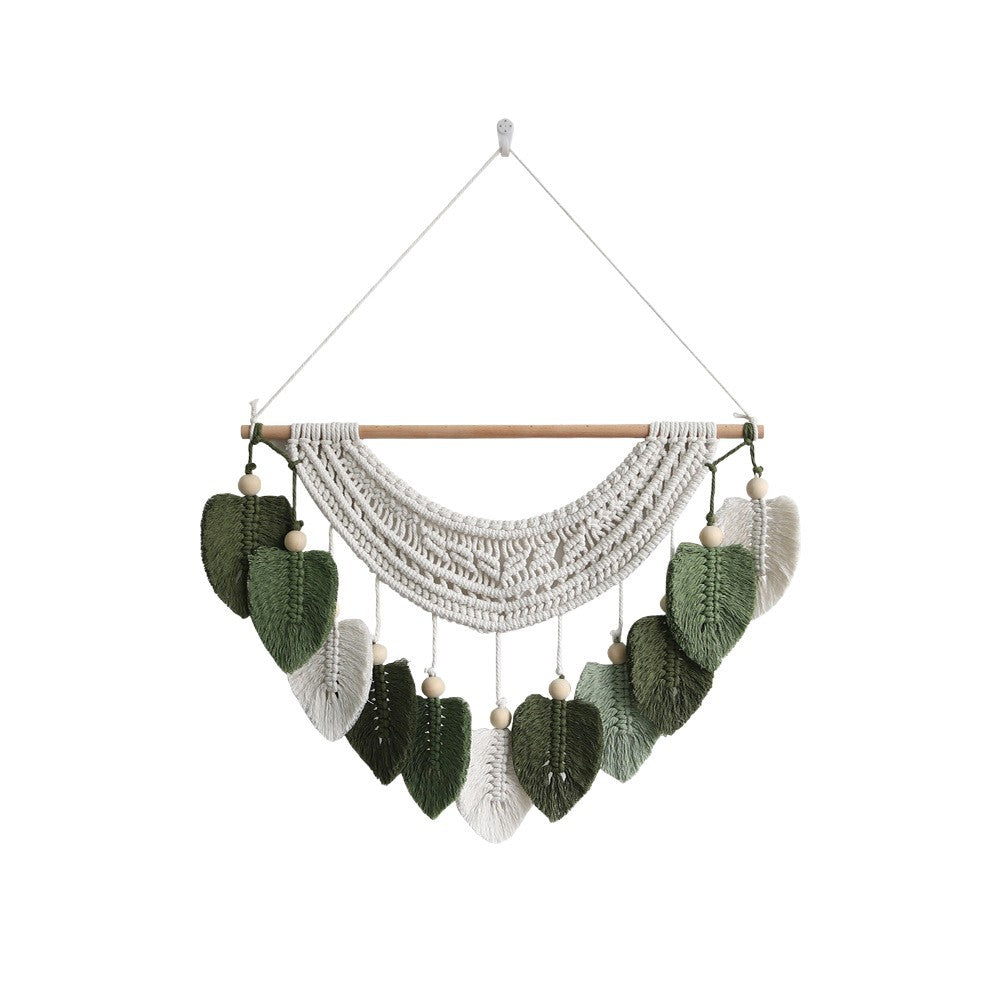 Décoration murale en macramé avec motif feuille