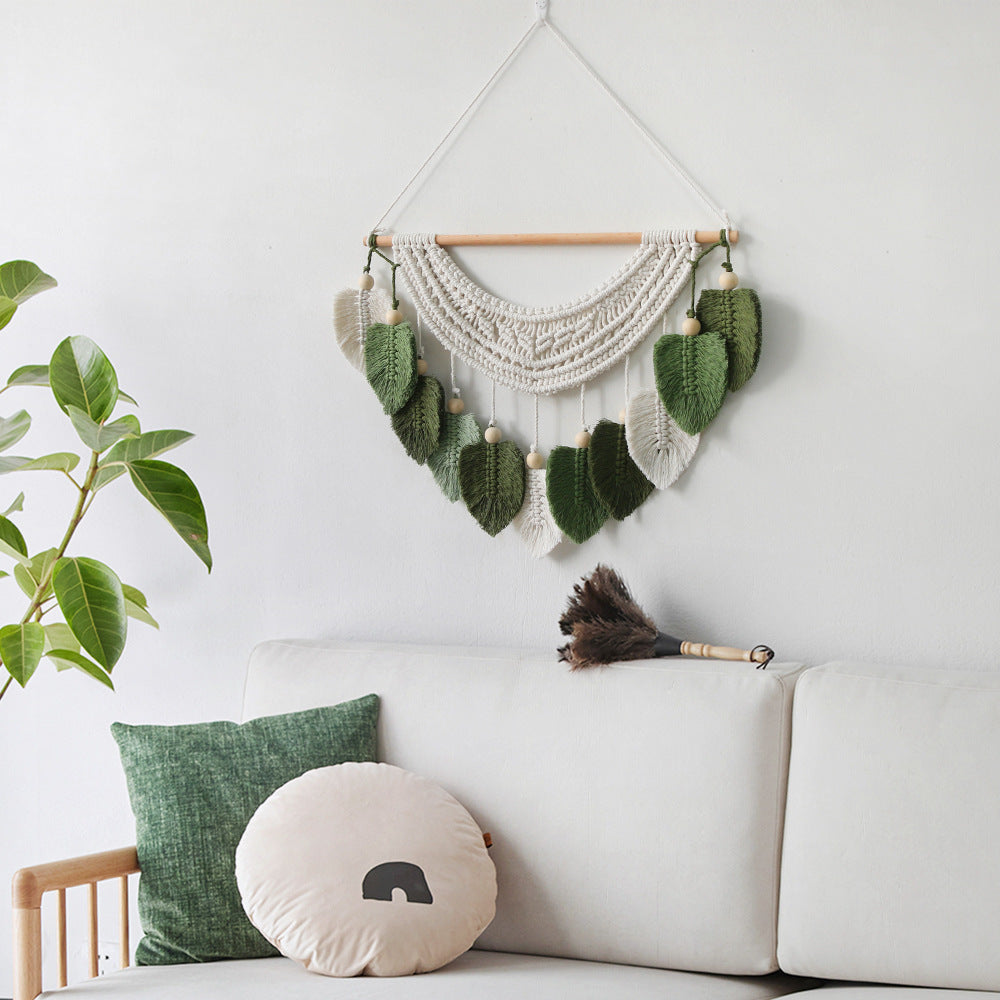 Décoration murale en macramé avec motif feuille