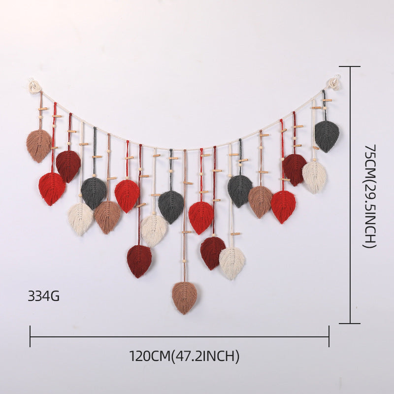 Décoration murale en macramé avec motif de feuilles