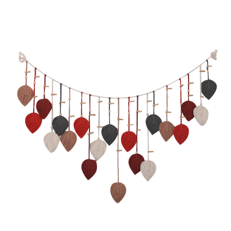 Décoration murale en macramé avec motif de feuilles