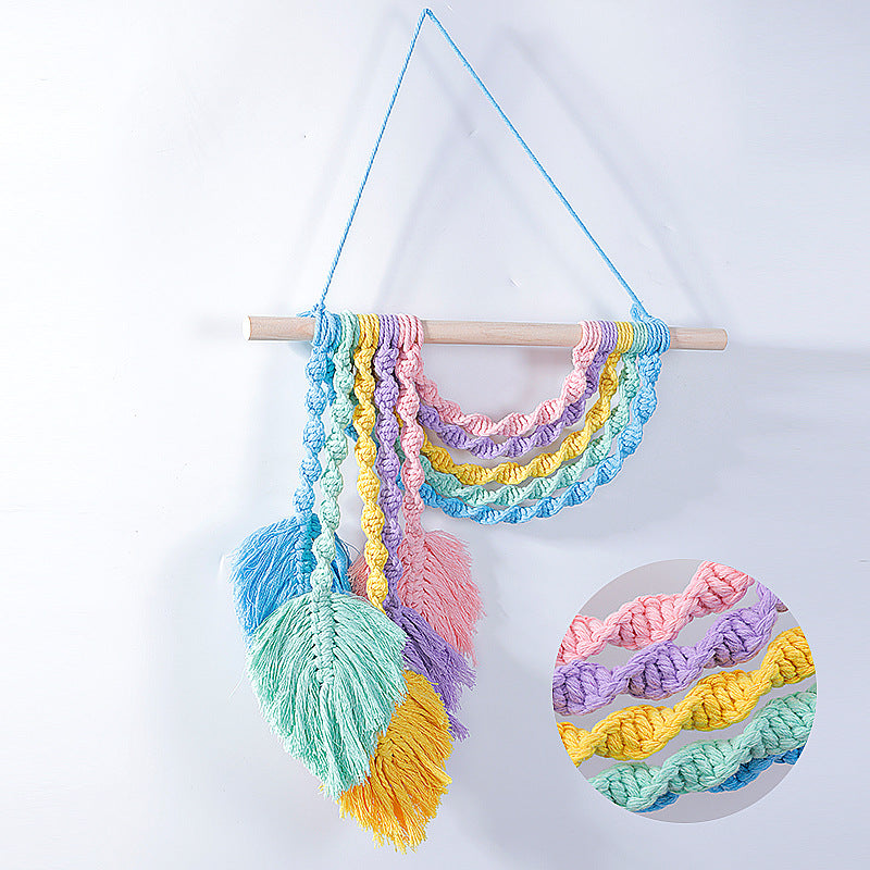 Décoration murale en macramé avec bol élévateur à franges colorées