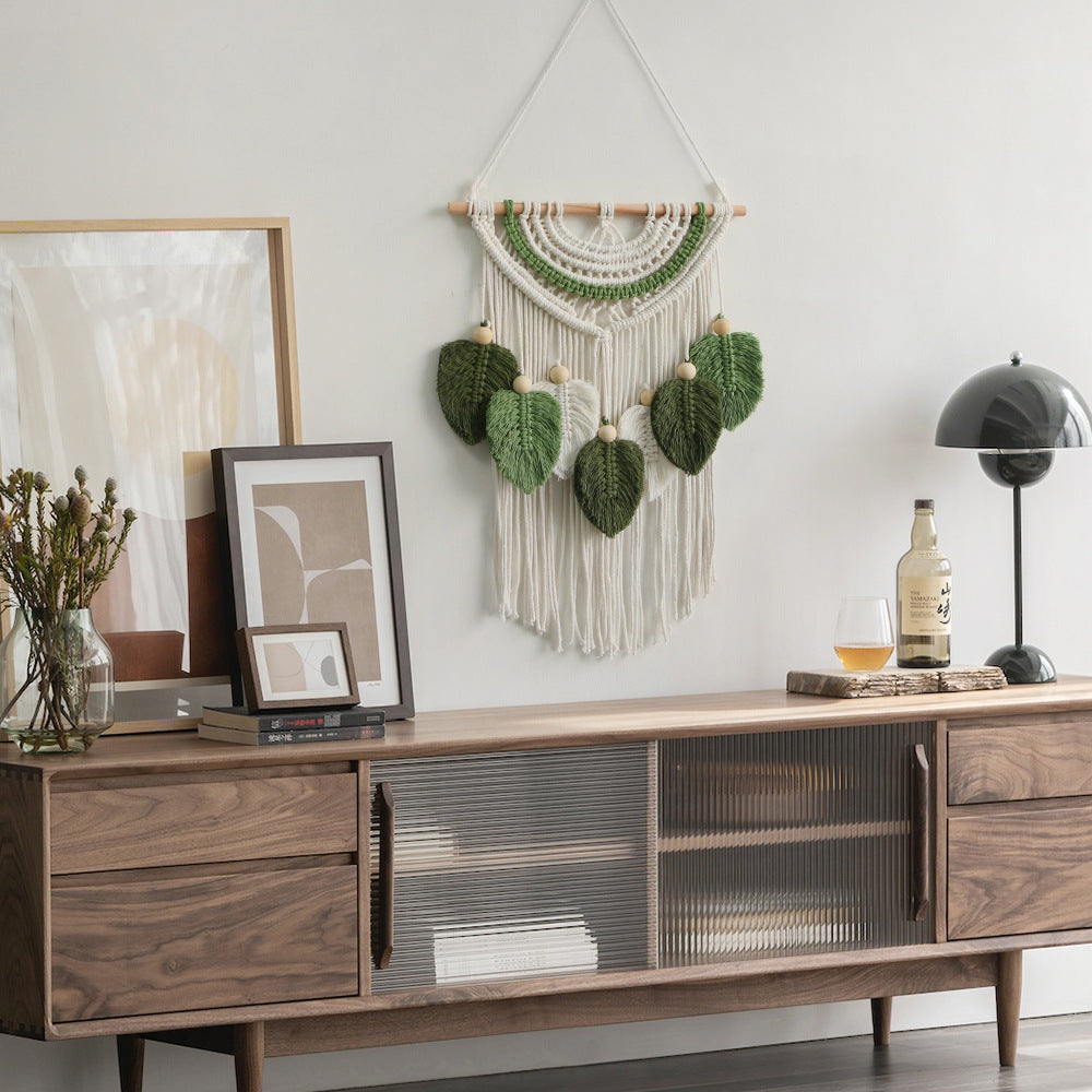 Décoration murale en macramé avec motif feuille