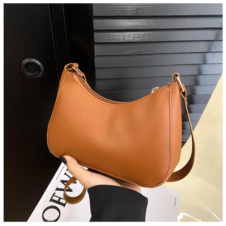 Sac à main élégant au design ondulé