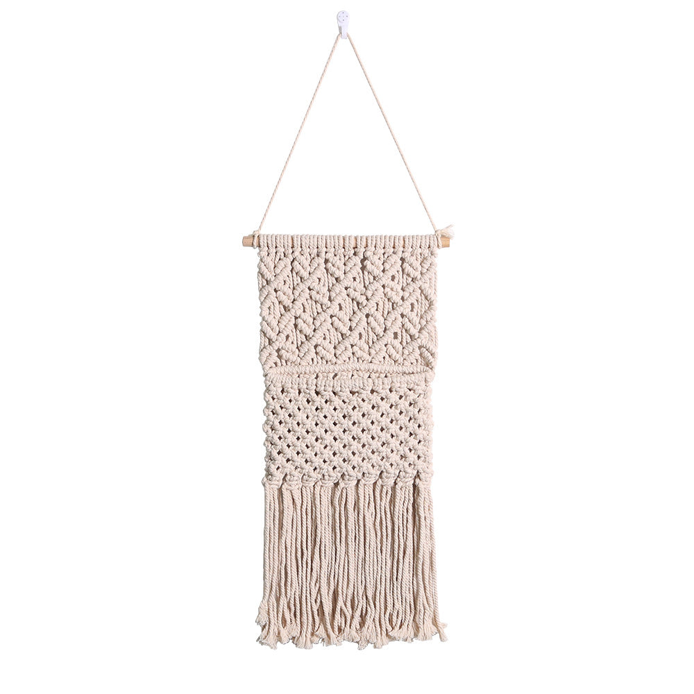 Décoration murale artistique en macramé avec une belle décoration à franges
