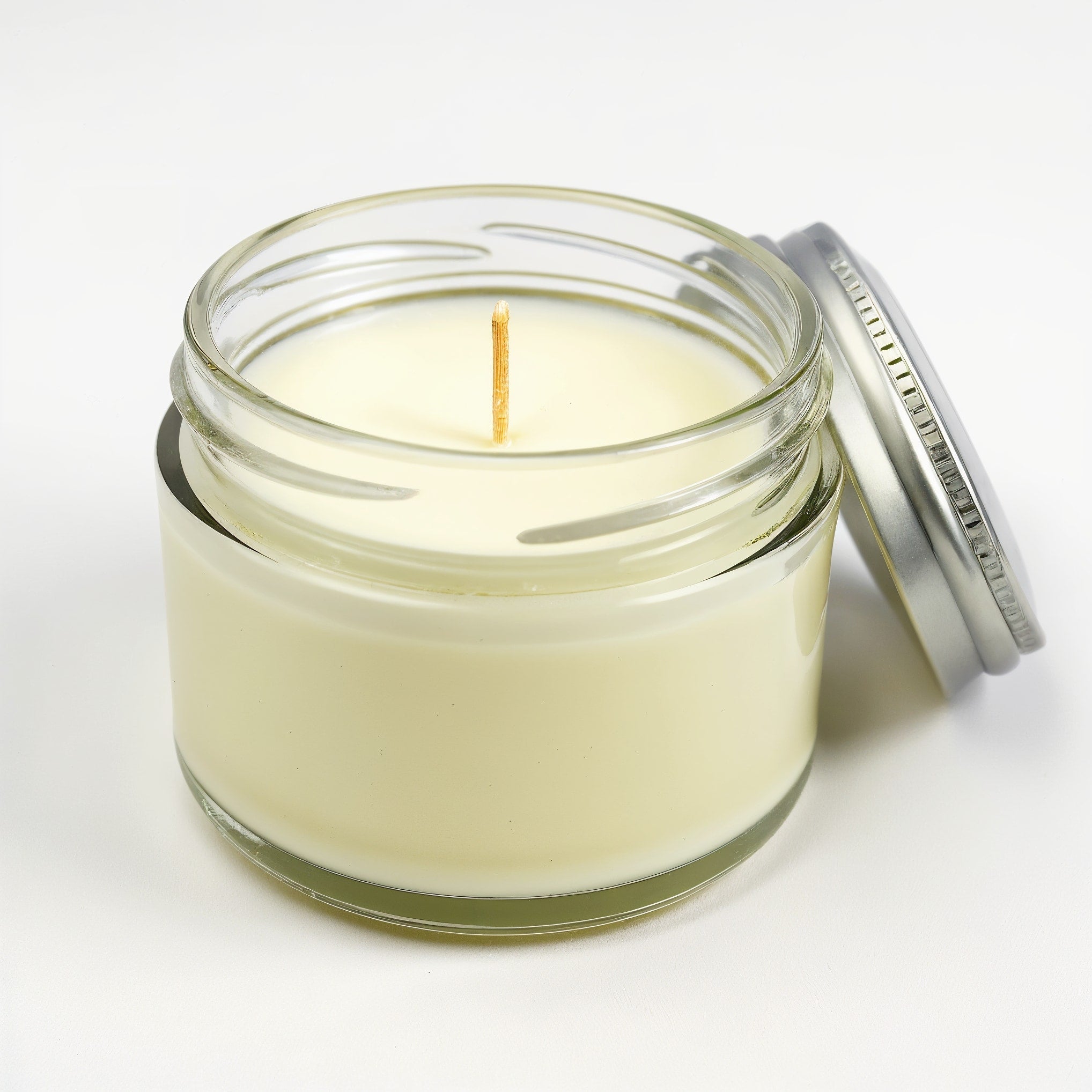 Bougie parfumée NARSAGO à la verveine citronnée en pot de verre transparent
