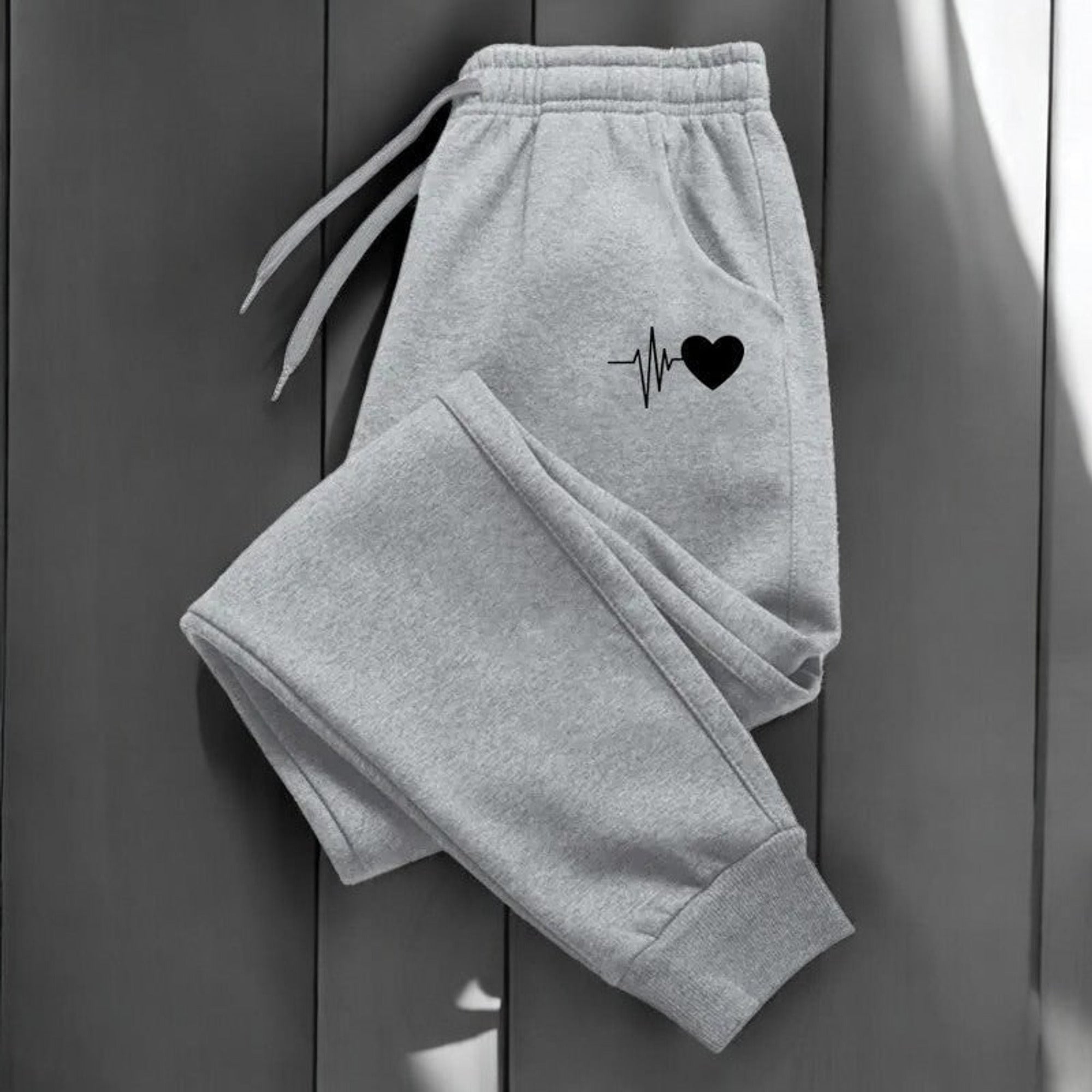 Jogging femme fitness avec taille ajustable à cordon et poches latérales