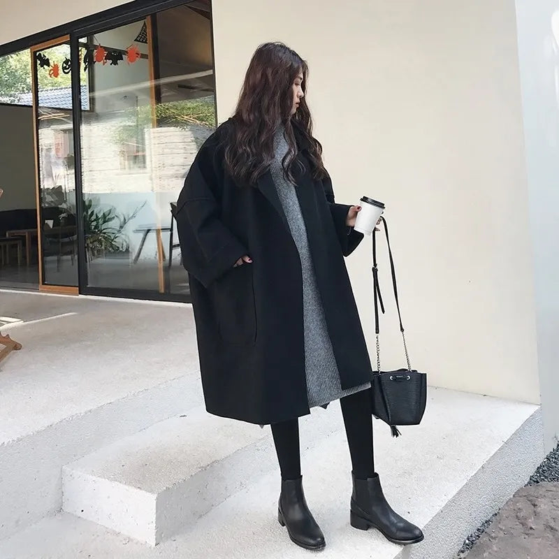 Manteau oversize femme avec revers et poches plaquées, poignets retroussés et épaules tombantes, café ou noir, tailles S